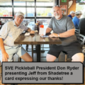 Jeff receiving a card from Don